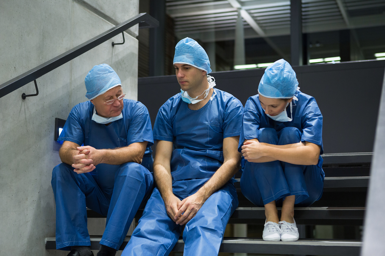 group of doctors on a staircase