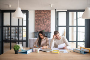 two people looking over plans to set up a business