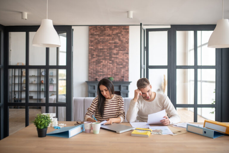 two people looking over plans to set up a business