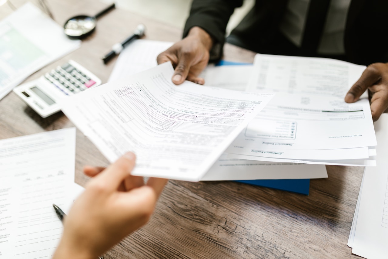 passing paper to apply for an insurance registration