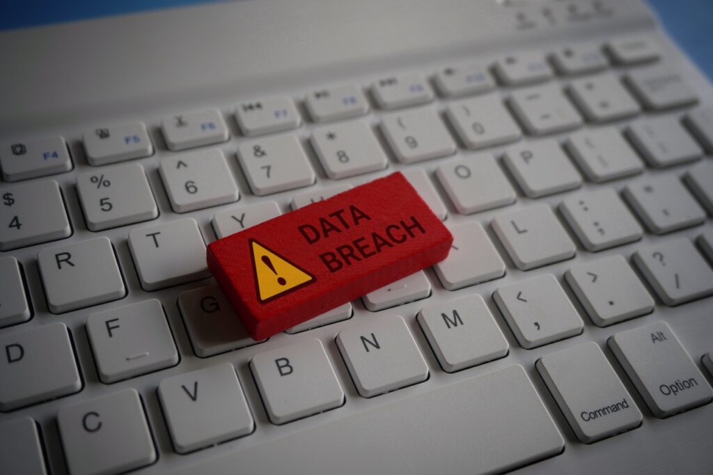 lego brick saying data breach on a keyboard