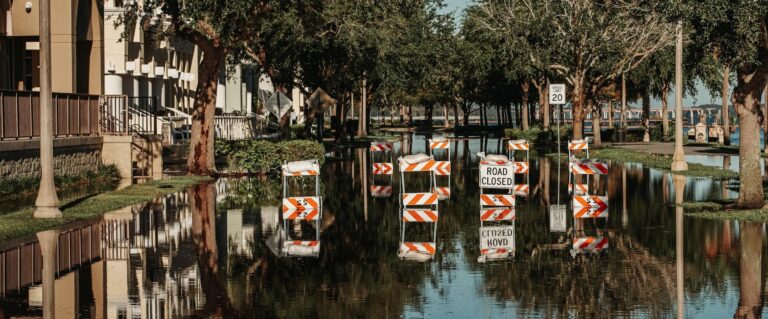 flooded street with closed sign